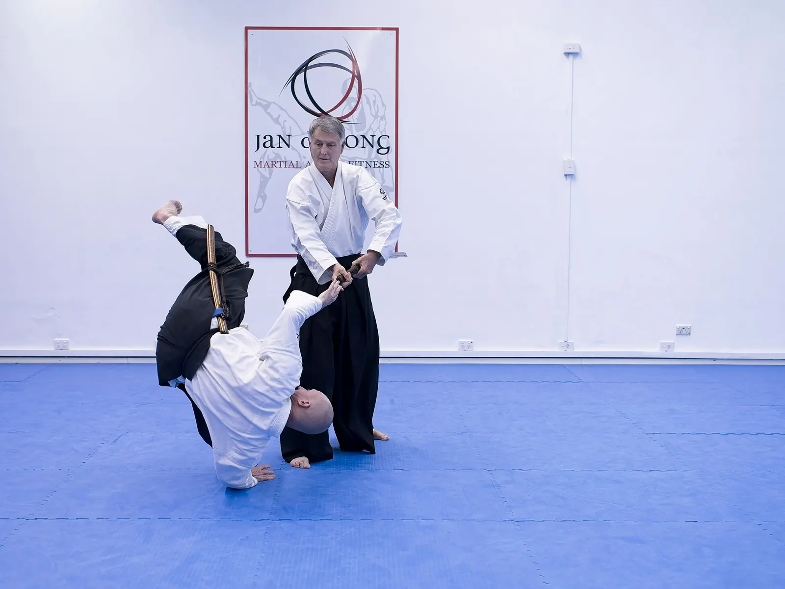 Sword disarmament technique with roll and breakfall